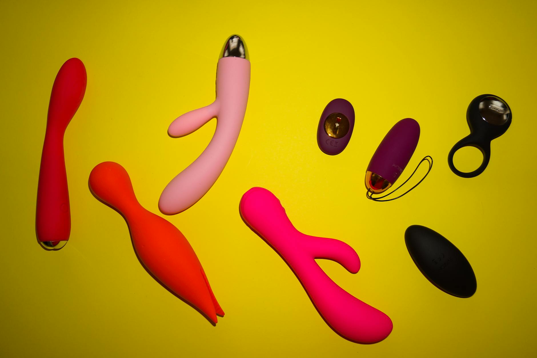 Pink lemon vibrator on purple background with romantic lighting